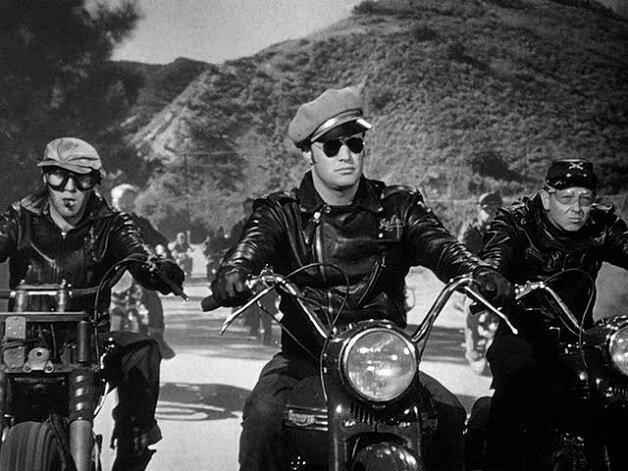 Biker Johnny, played by Marlon Brando, leads a column of his biker gang